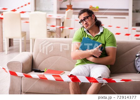 Young male student studying at home in self-isolation concept Young male student studying at home in self-isolation concept 72914377