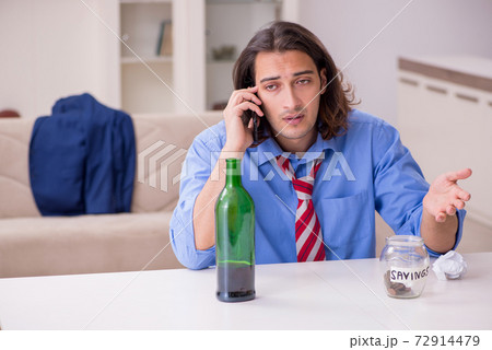 Young male employee being fired from his work at home 72914479