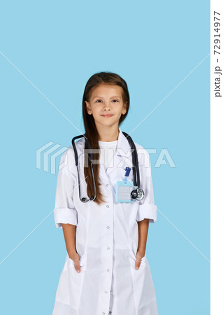 Cute child in doctor coat with stethoscope 72914977