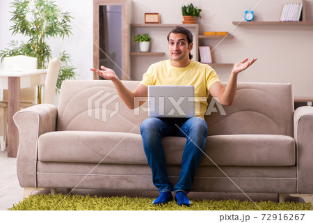 Young man student freelancer in teleworking concept 72916267