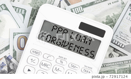 PPP LOAN Forgiveness text on hundred dollar notes. Money PPP LOAN Forgiveness text on hundred dollar notes. Money 72917124