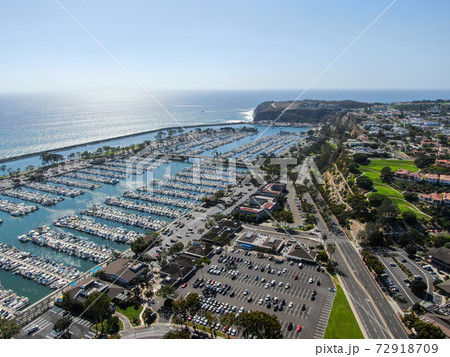 Aerial view of Dana Point Harbor town and beach. Aerial view of Dana Point Harbor town and beach. 72918709