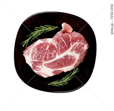 Pieces of raw pork steak in black plate.top view Pieces of raw pork steak in black plate.top view 72921392