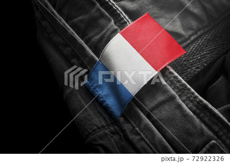 Tag on dark clothing in the form of the flag of the France 72922326