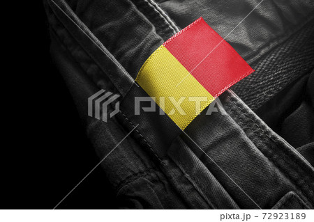 Tag on dark clothing in the form of the flag of the Belgium 72923189