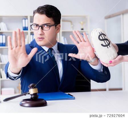Judge in bribe concept with money 72927604
