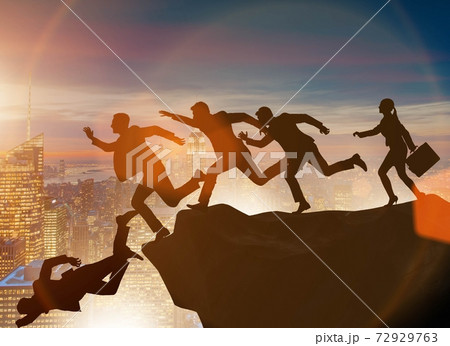 Business people falling off the cliff Business people falling off the cliff 72929763