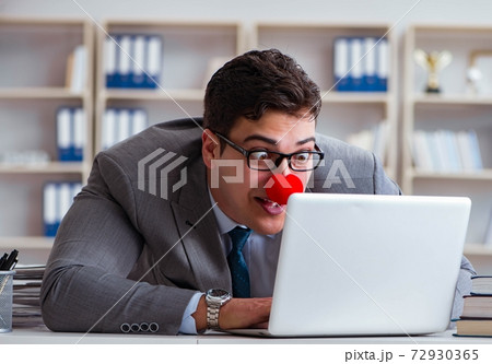 Clown businessman working in the office 72930365