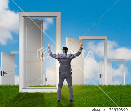 Businessman facing many business opportunities Businessman facing many business opportunities 72930390