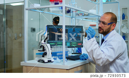 Man scientist working at vaccine development 72930573