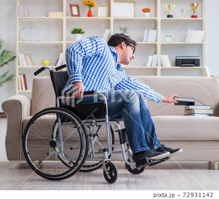 Young student on wheelchair in disability concept 72931142