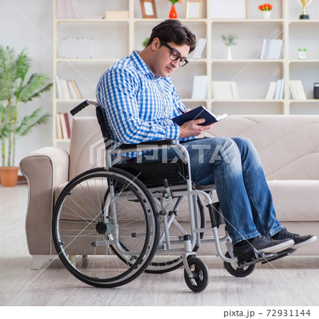Young student on wheelchair in disability concept Young student on wheelchair in disability concept 72931144