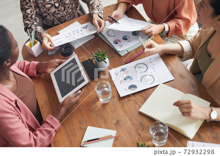 Team of Businesswomen Brainstorming at Meeting Team of Businesswomen Brainstorming at Meeting 72932298