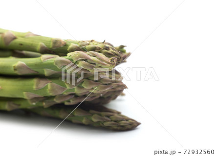 Closeup of organic asparagus on white background Closeup of organic asparagus on white background 72932560