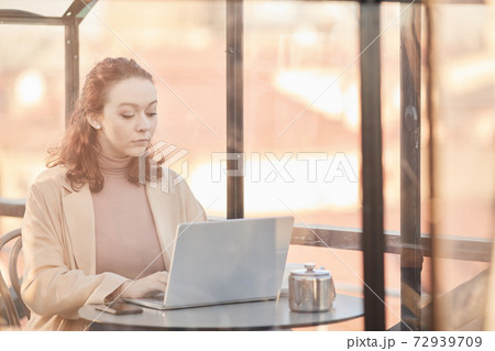 Businesswoman working on laptop Businesswoman working on laptop 72939709
