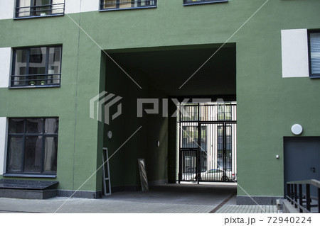 view on new modern residental buildings, modern backjard , windows on green and white wall 72940224