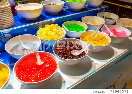 Street counter selling ice cream with different flavors 72940571