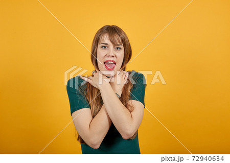 Hands around throat, screaming, panicking in trouble as chokes on food stuck 72940634