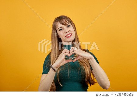Hands shows the symbol of heart. Love to our pancreas. Pretty romantic young Hands shows the symbol of heart. Love to our pancreas. Pretty romantic young 72940635