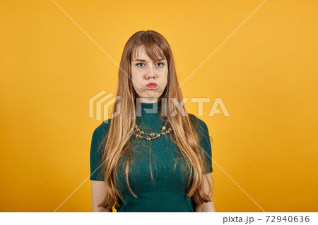Upset offended looking big eyes, blowing cheeks being annoyed after quarrel Upset offended looking big eyes, blowing cheeks being annoyed after quarrel 72940636