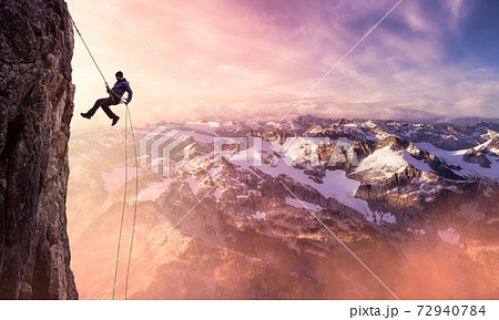 Epic Adventurous Extreme Sport Composite of Rock Climbing Man Rappelling 72940784