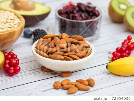 Group Fruits Breakfast with bread Whole grains and nuts, yogurt mix with Cherry , banana, avocado in the wooden table. Breakfast for Health and Diet concept 72954030