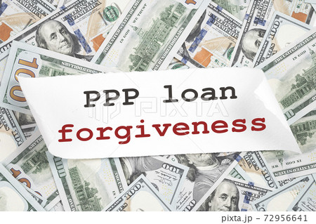 PPP LOAN Forgiveness text on hundred dollar notes. Money PPP LOAN Forgiveness text on hundred dollar notes. Money 72956641