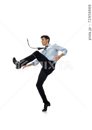 Happy young man dancing in casual clothes or suit, remaking legendary moves of celebrity from culture history 72956666