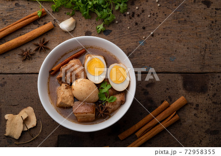 Egg and Pork in Sweet Brown Sauce ,Kai Pa Lo in white bowl. 72958355