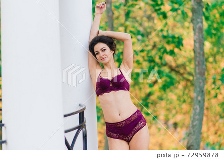 Beautiful young woman in lingerie in autumn forest 72959878