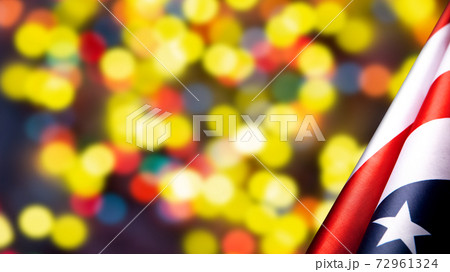 American flags border over defocused yellow bokeh lights background. Flyer. American flags border over defocused yellow bokeh lights background. Flyer. 72961324