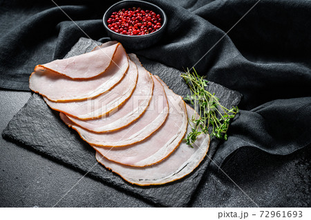 Cooked pastrami pork, gourmet ham. Black background. Top view Cooked pastrami pork, gourmet ham. Black background. Top view 72961693