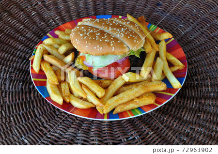 beef cheeseburger and french fries 72963902