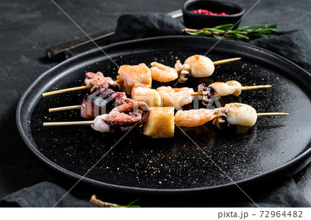Barbecue with seafood. Kebab on wooden skewers 72964482