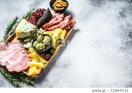 Antipasto platter with ham, prosciutto, salami, 72964511