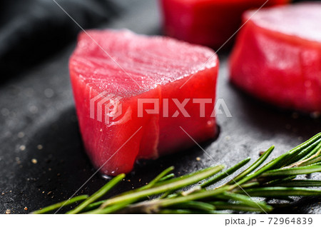Raw fillet steak tuna. Black background. Top view. Raw fillet steak tuna. Black background. Top view. 72964839