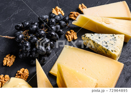 Different types of delicious cheese with walnuts 72964895