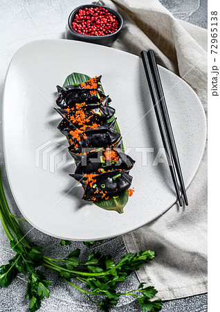 Black Dim sum dumplings. Asian cuisine. Gray 72965138