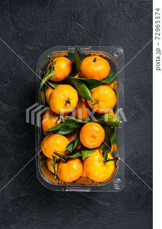 Tangerines, mandarines in a plastic container from Tangerines, mandarines in a plastic container from 72965374