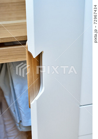 Modern wardrobe with finger pull design. Wooden wardrobe with