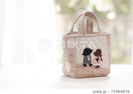 Quilt bag handmade craft on garden background Quilt bag handmade craft on garden background 72969676