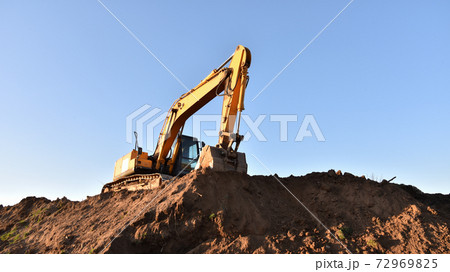 Excavator working at construction site.  72969825