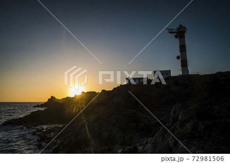 Beautiful scenic landscape with classic lighthouse and golden sunset in background - concept of travel and scenic place. for tourism 72981506