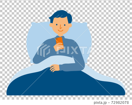 A man who operates a smartphone in a futon 72982078