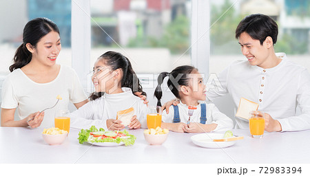 Family eating breakfast Family eating breakfast 72983394