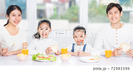 Family eating breakfast 72983399