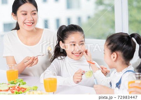 Family eating breakfast Family eating breakfast 72983447