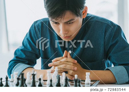 Man playing chess Man playing chess 72983544