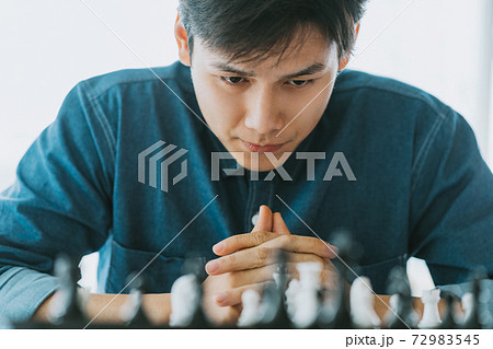 Man playing chess Man playing chess 72983545