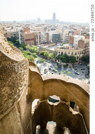 スペインバルセロナのサグラダファミリアの窓から見えるバルセロナの街並みの写真素材